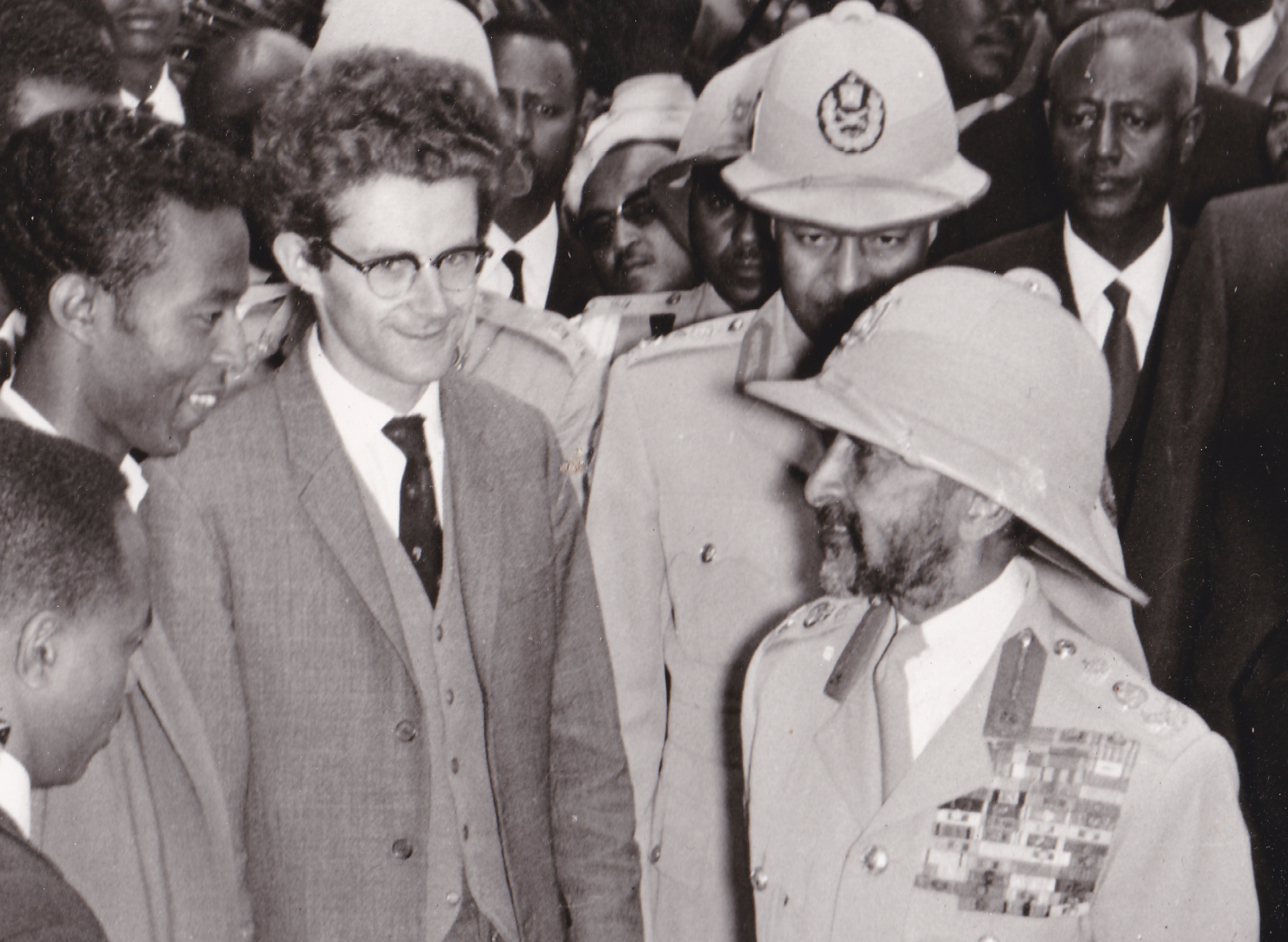 Image of a crowd of people with six people in the forefront of the photo