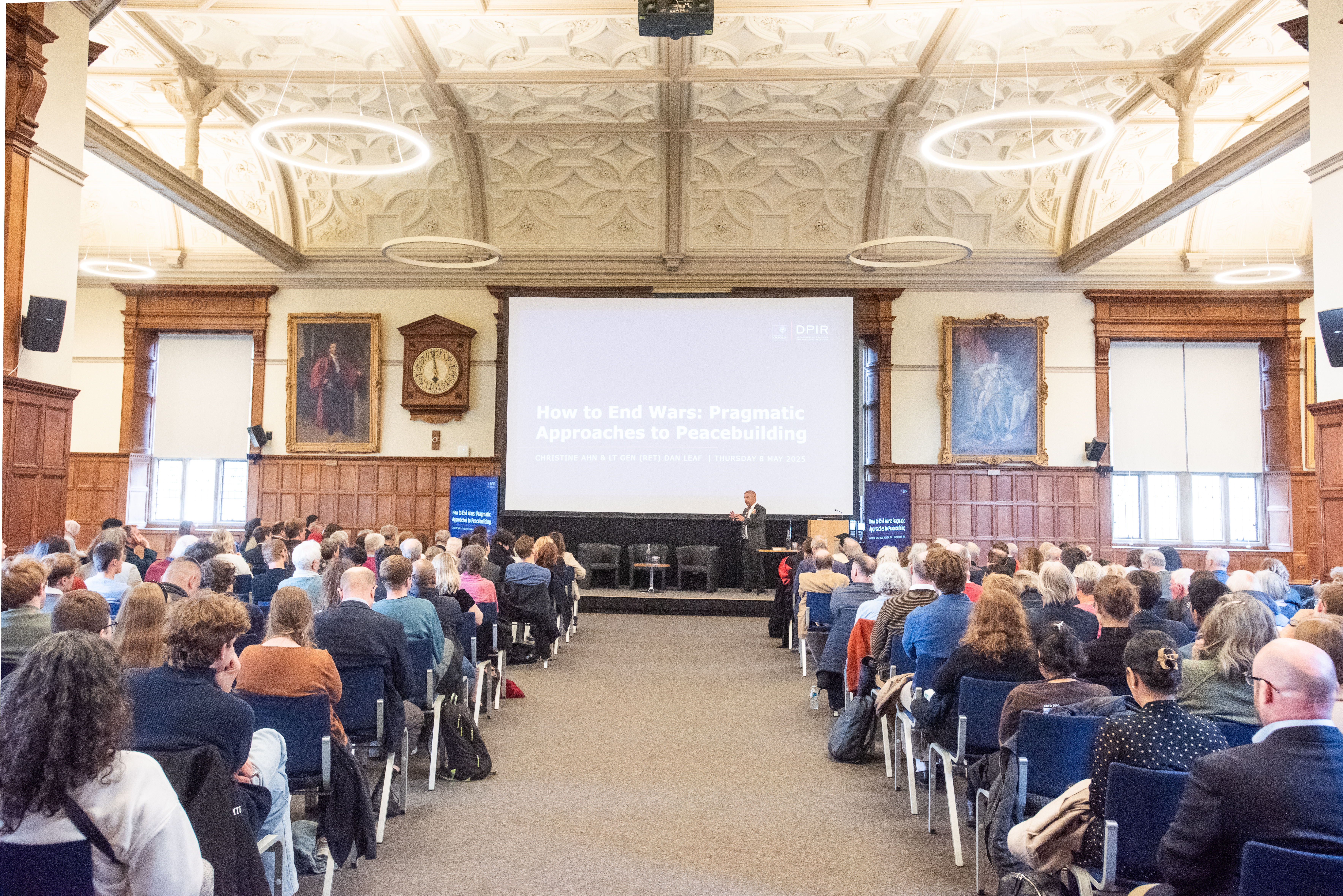 Image of a group of people seated in a building listening to a lecture