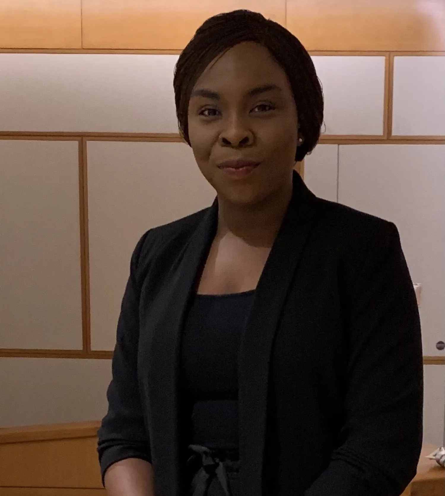 a person in a black suit.