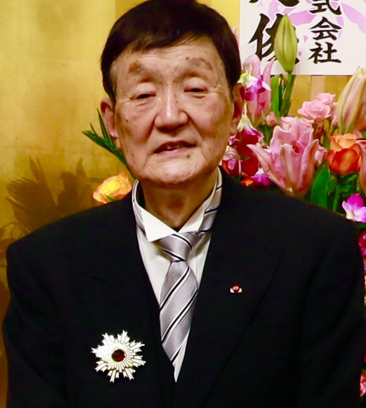 a person in a suit and tie. 