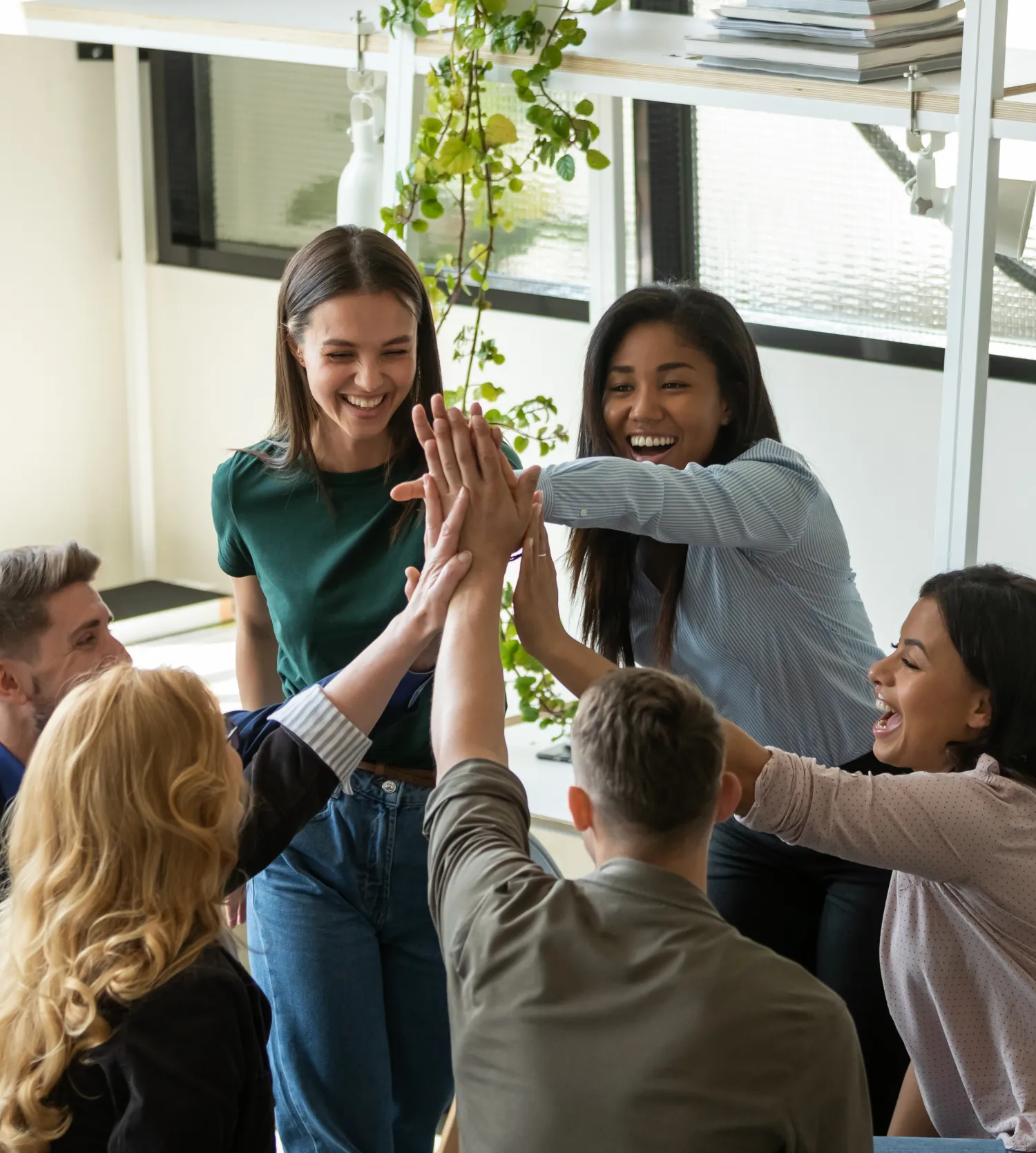 image of a group of people putting their hands together