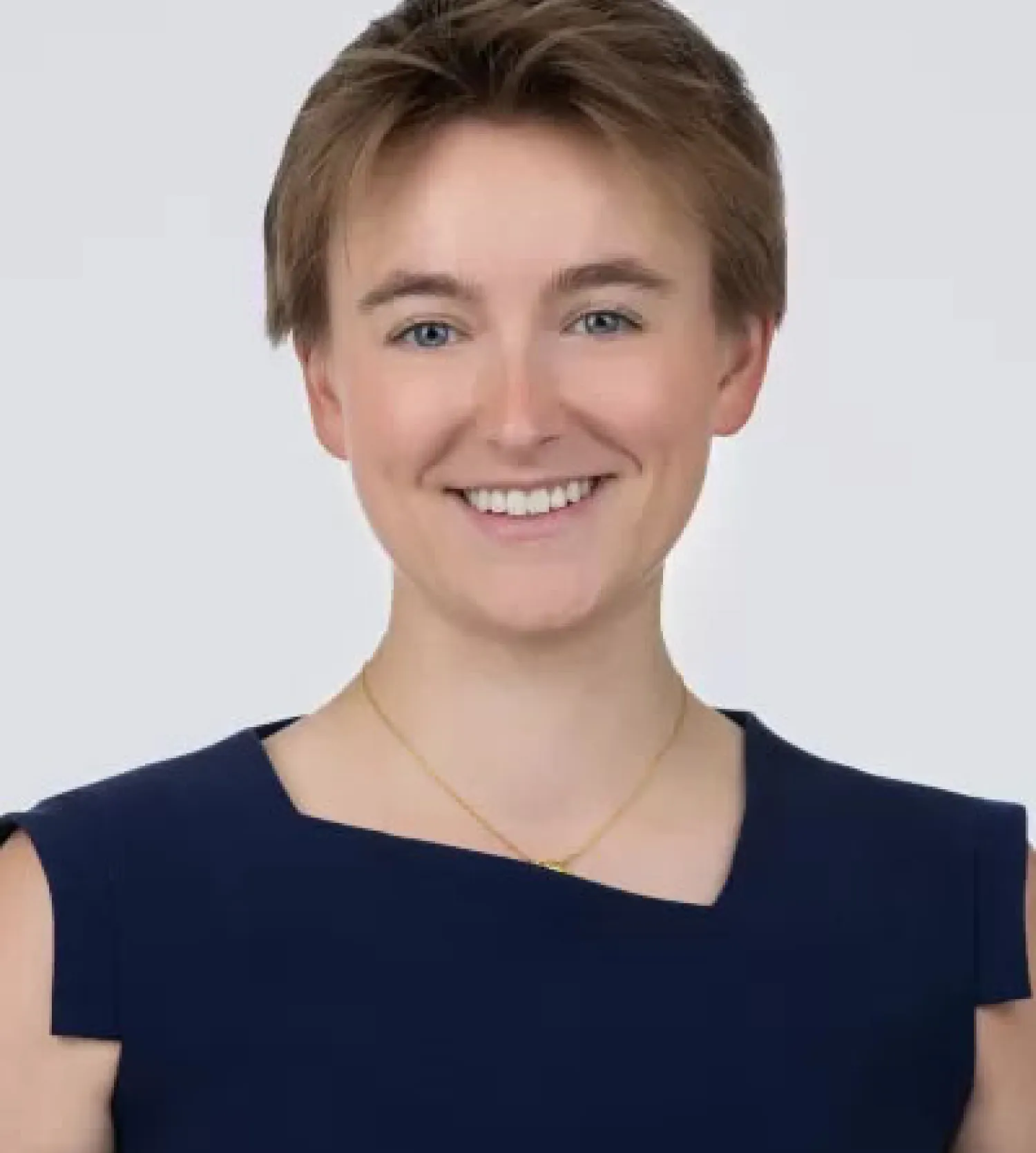 a woman wearing a black top smiling at the camera