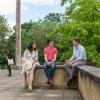 A mix of DPIR graduate students, sat outside the Manor Road Building