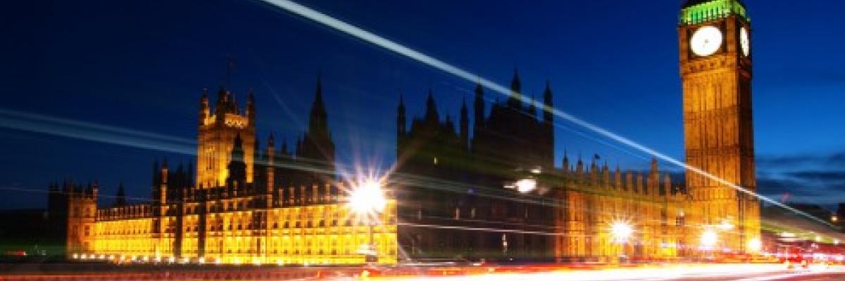 Image of Big Ben and the Houses of Parliament lit up at night.