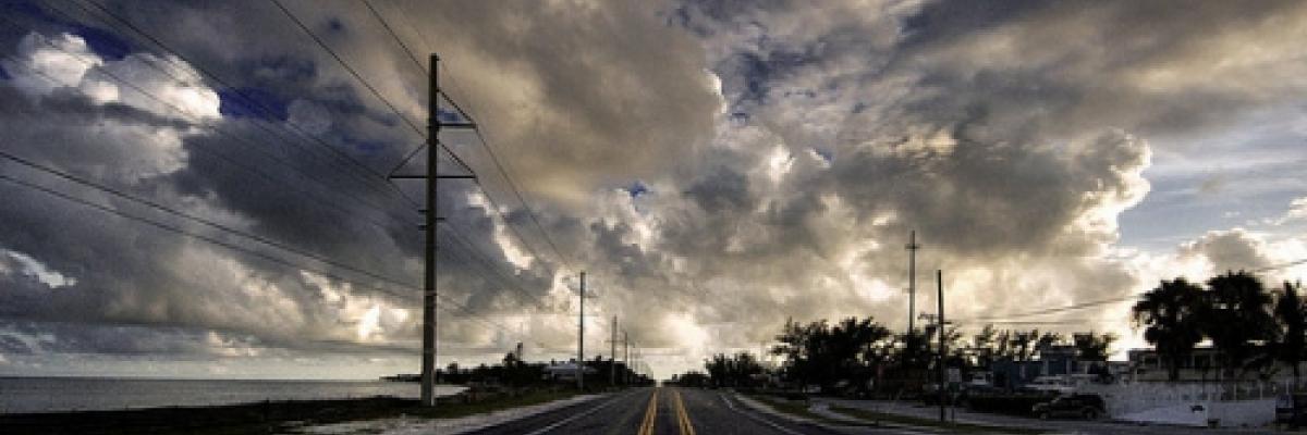 Image of a road with clouds in the sky