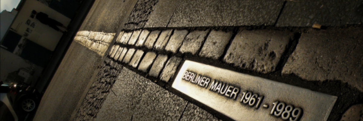 Image of a plaque signifying where the Berlin Wall once stood