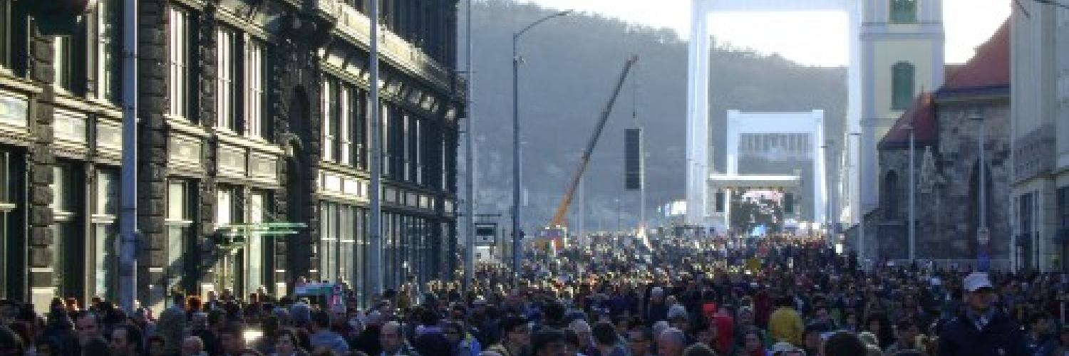 A crowd of people in a cityscape