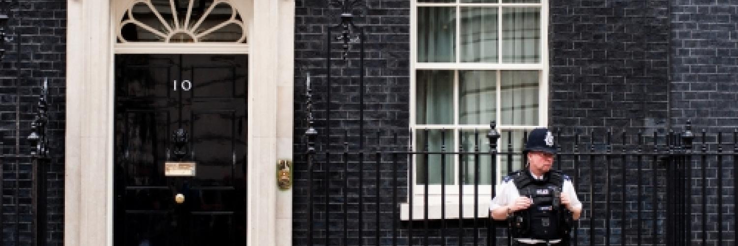 Image of 10 Downing Street with a police officer in front of the property