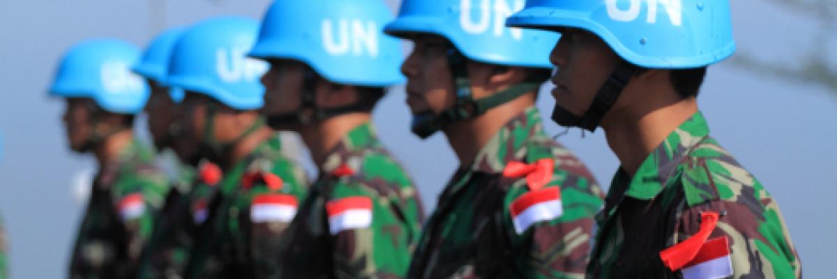 Five UN peacekeeping troops lined up together