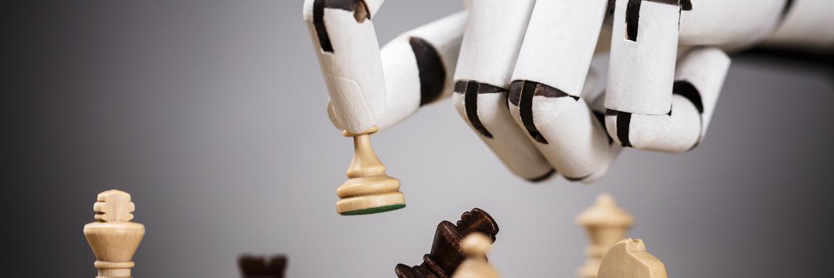 a robot hand over a chess board