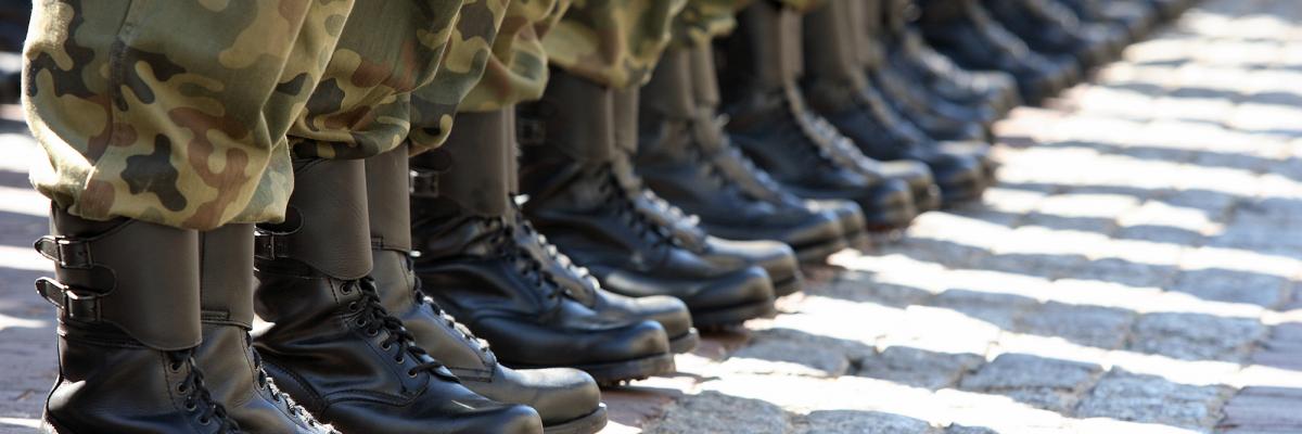 A line of soldiers showing their legs and boots