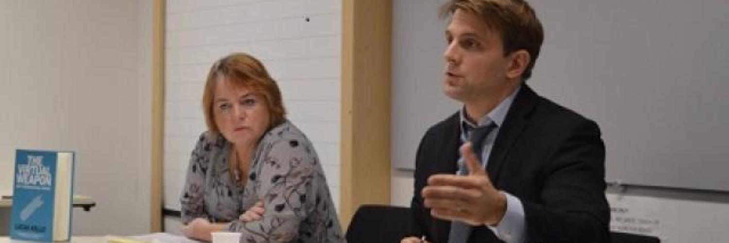 A woman and a man sat at a table