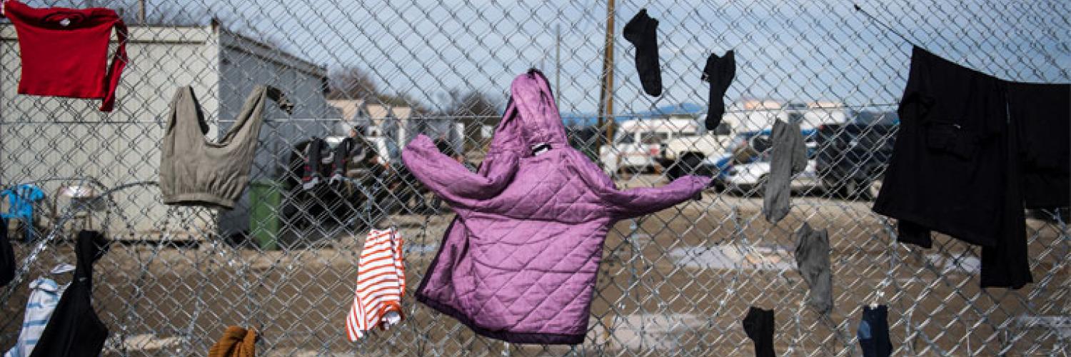 A fence with clothes drying on it