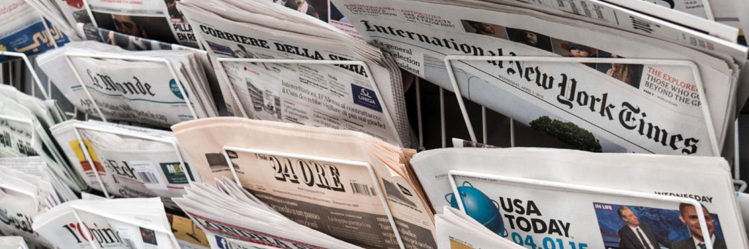 A number of foreign newspapers in a newspaper stand