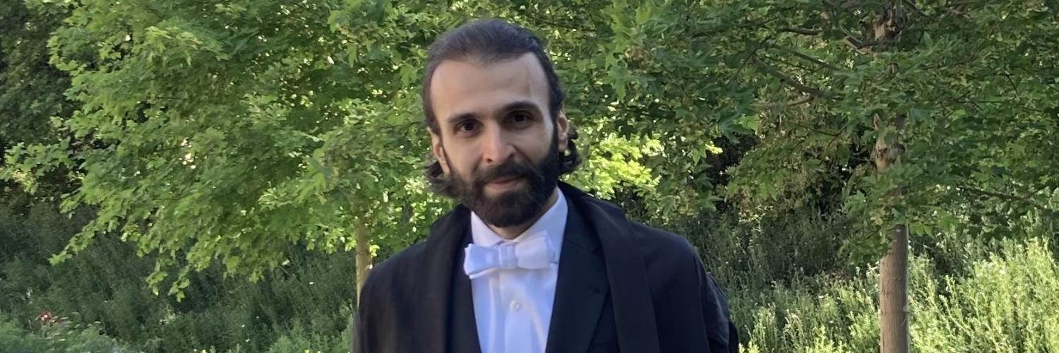 a person in a suit and bow tie