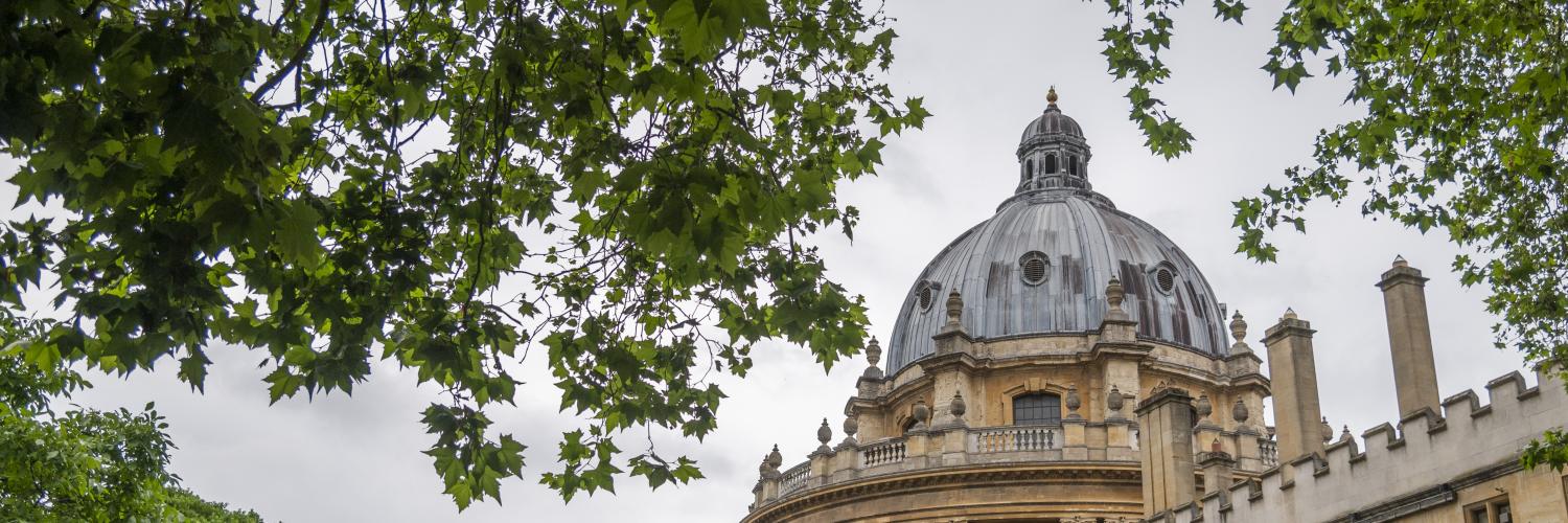 a building with a dome and trees.