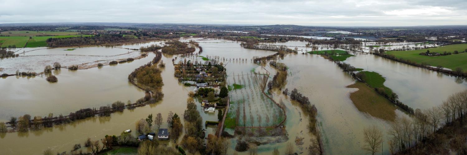 a flooded area with houses and trees