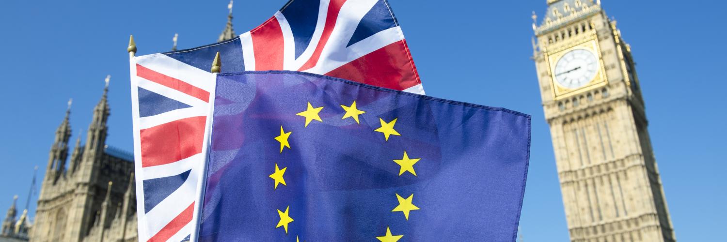 image of a Union Jack flag and EU flag in front of Big Ben and the Houses of Parliament in London