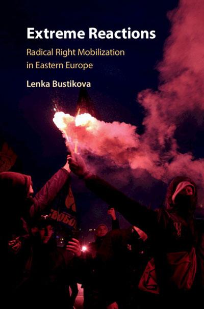 Book cover of 'Extreme Reactions: Radical Right Mobilization in Eastern Europe' by Lenka Bustikova showing a group of people stood in the dark holding flares in the air