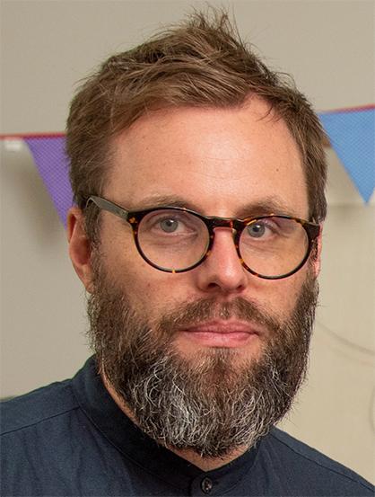 profile image of a man with glasses and a beard