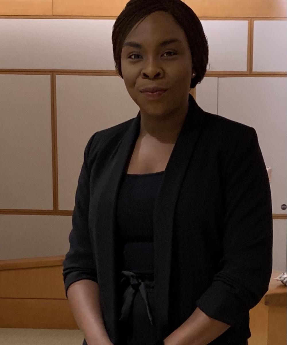 a person in a black suit.
