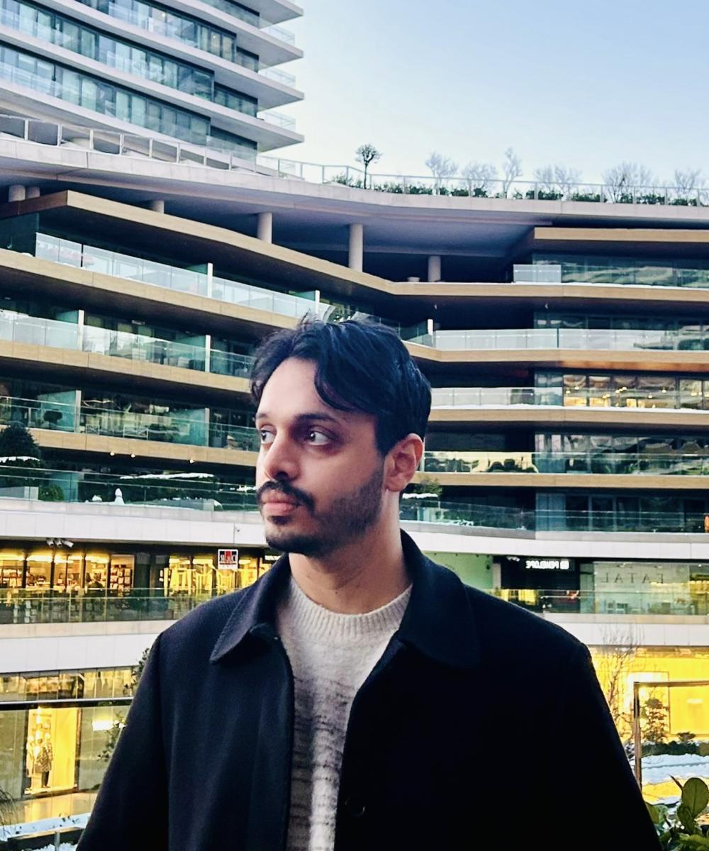 A person stood in front of a building