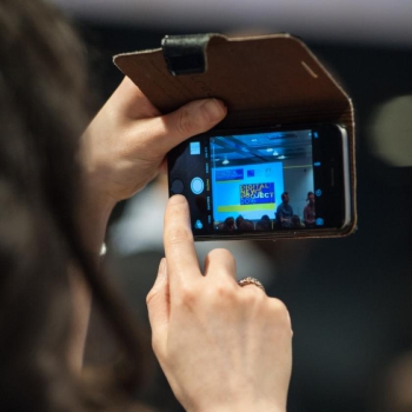Image of someone taking a photo with a smartphone