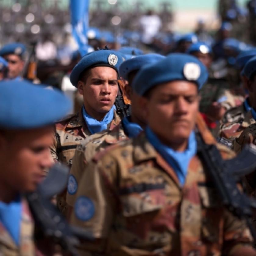 Image of a group of troops wearing blue berets