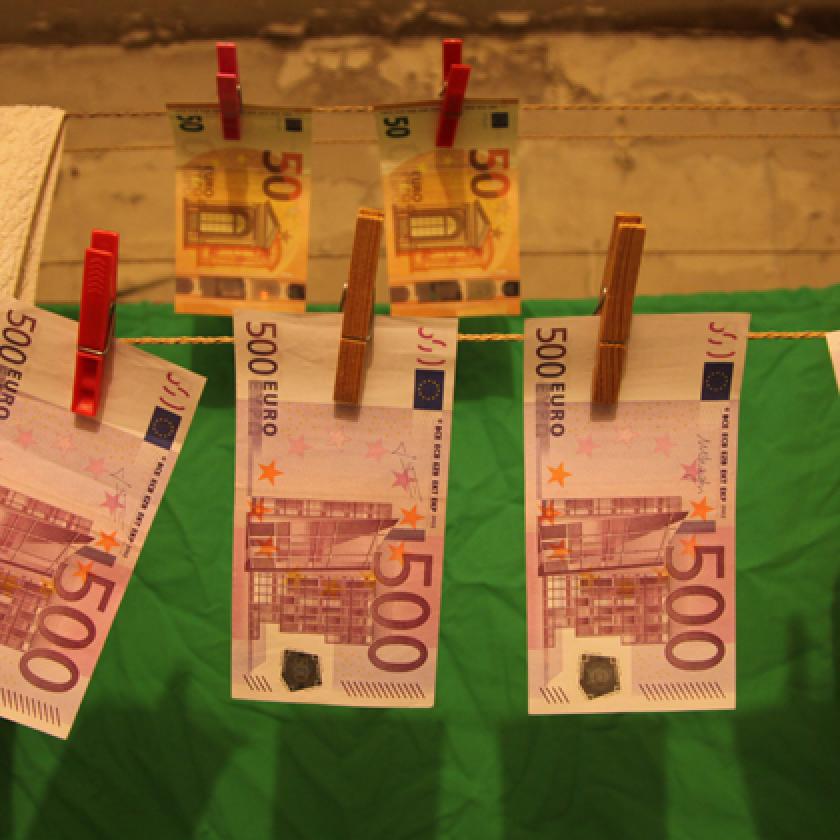 Image of bank notes hanging on a washing line