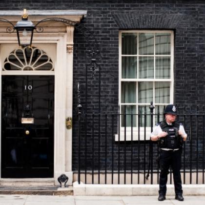 Image of 10 Downing Street with a police officer in front of the property