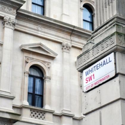 Image of Whitehall street sign with a building in the background