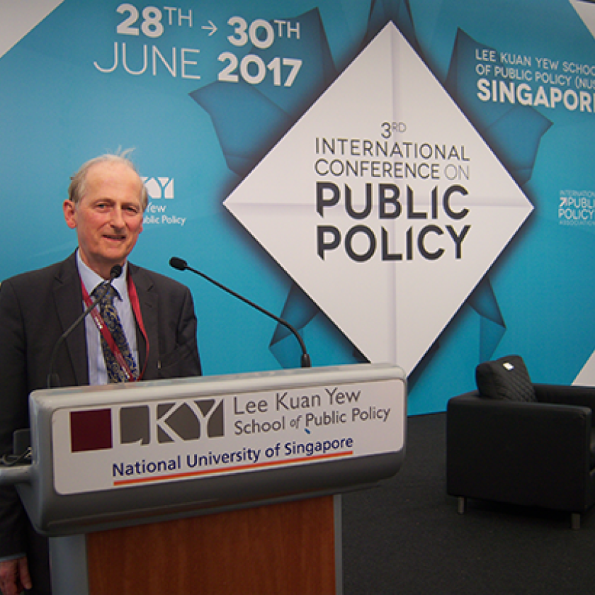 Christopher Hood giving a lecture in Singapore