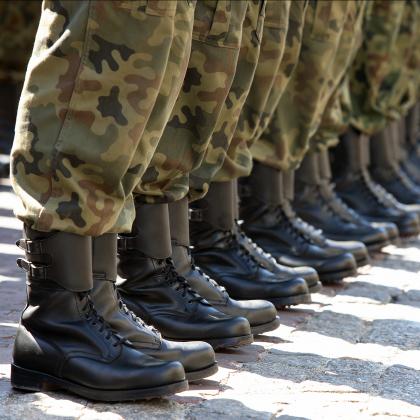 A line of soldiers showing their legs and boots