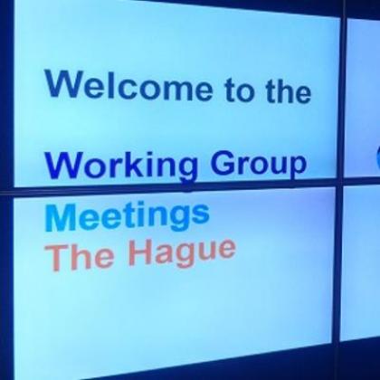 Display screen showing the text 'Welcome to the Working Group Meetings. The Hague'