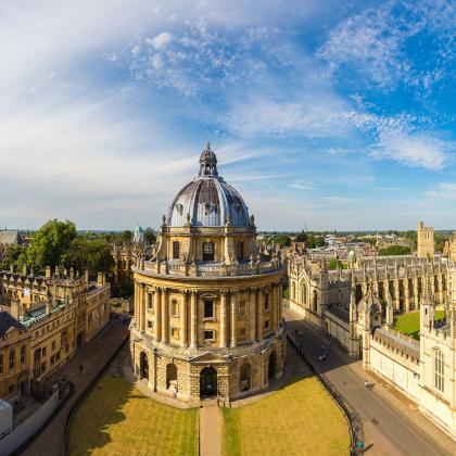 aerial image of the Radcliffe Camera in Oxford, with a  blue sky in the background