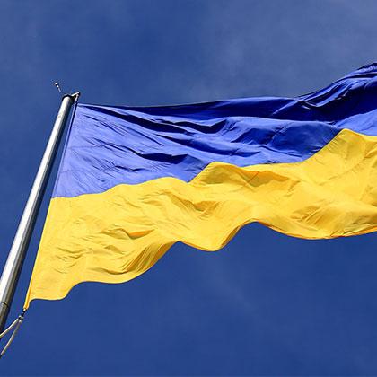 Ukraine flag against blue sky