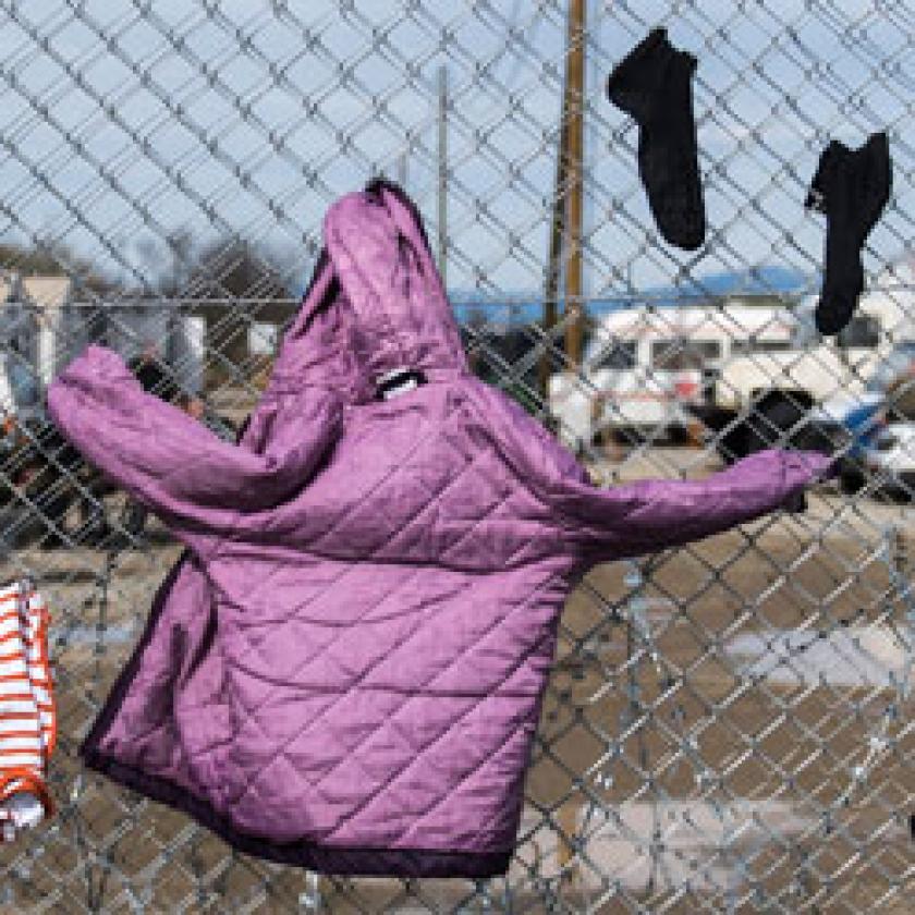 A fence with clothes drying on it