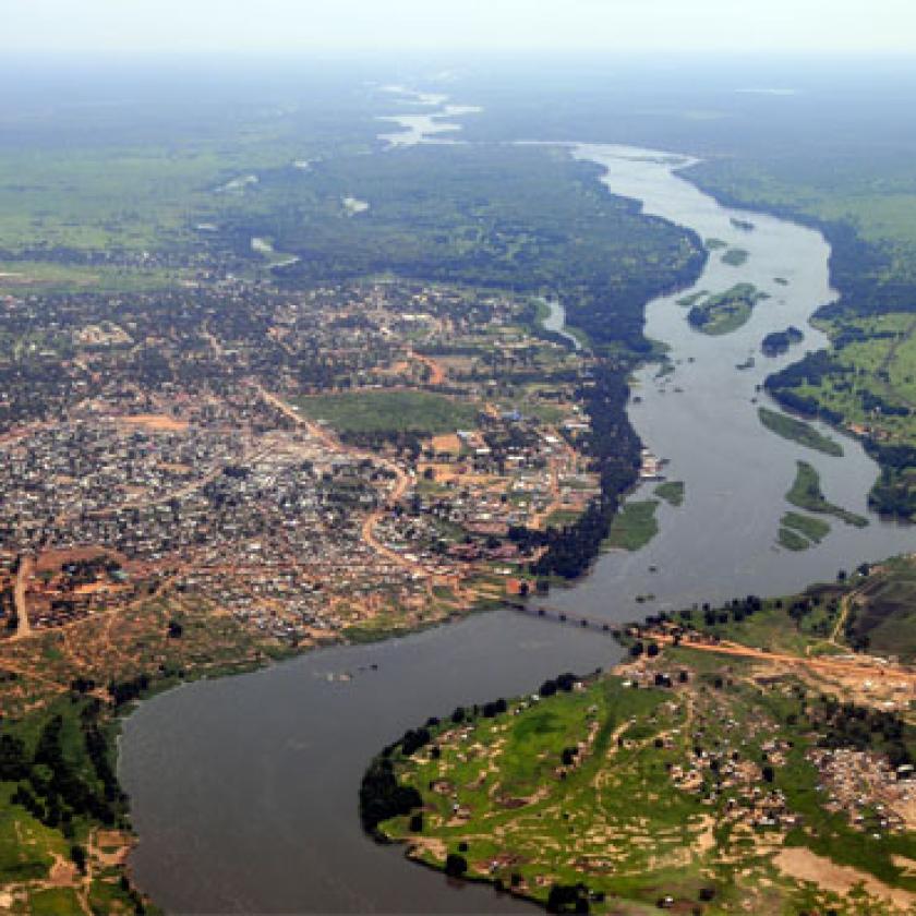 Aerial image of a settlement with a river running through it