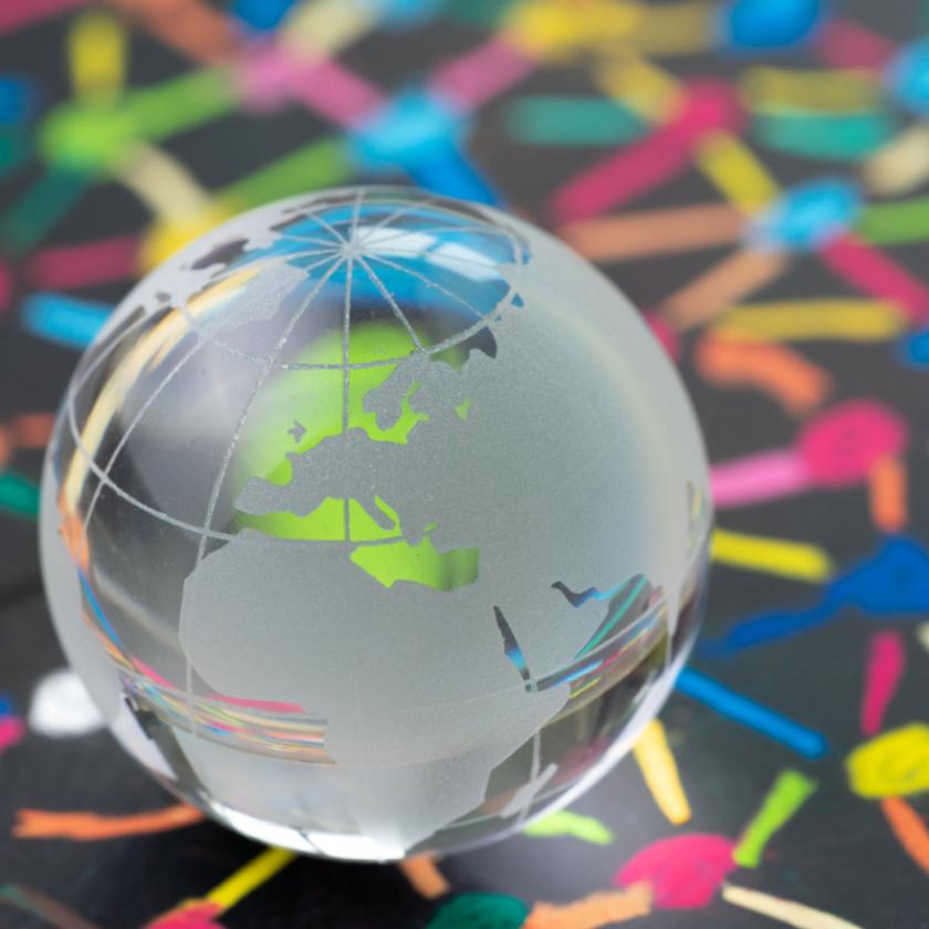 Glass globe on patterned background