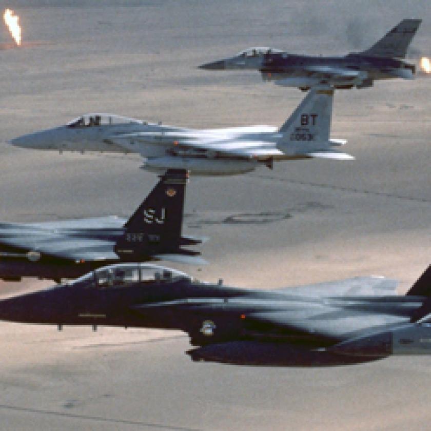 A group of airplanes flying in formation in a smoky sky.