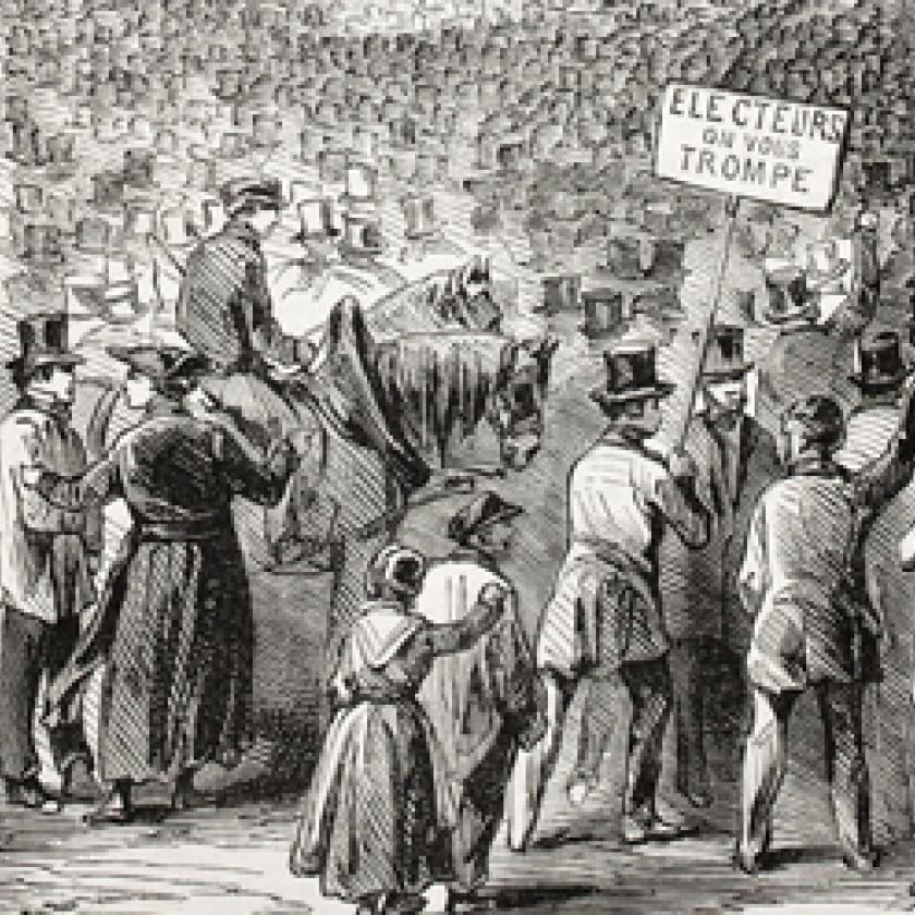 A group of people marching in a street