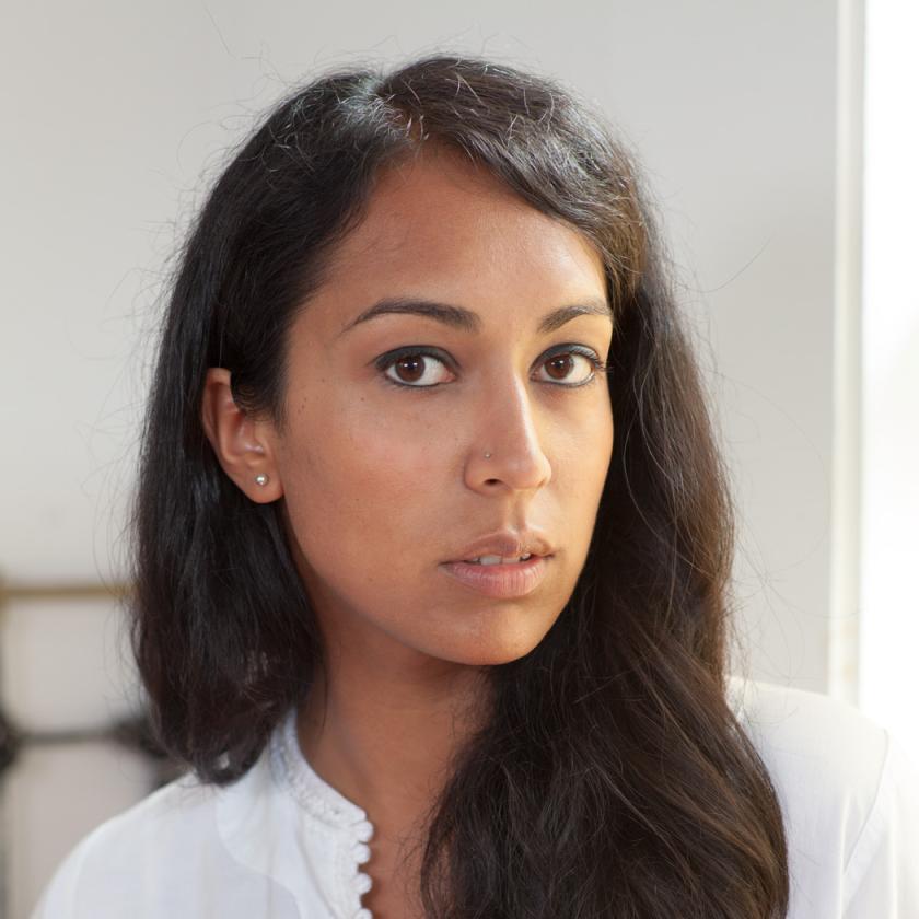 Image of a person with long hair looking at the camera