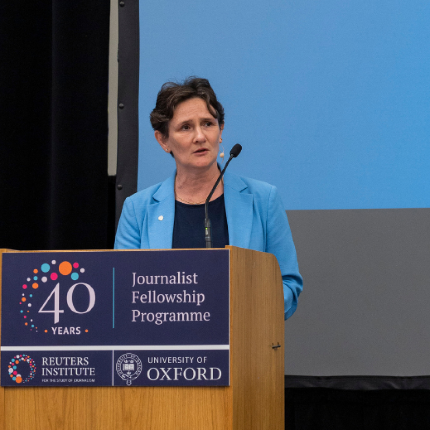 Vice-Chancellor of Oxford University, Professor Irene Tracey standing at a lecturn delivering a speech in front of a blue background