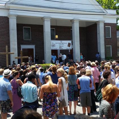 A crowd of people stood outside of the Charleston church shooting memorial service.