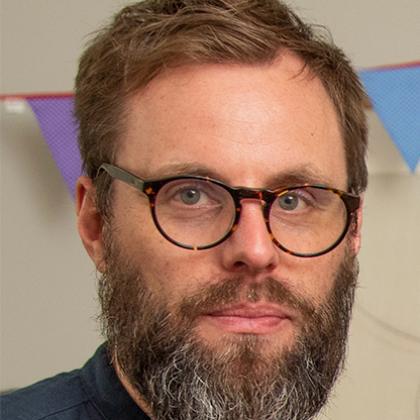 profile image of a man with glasses and a beard