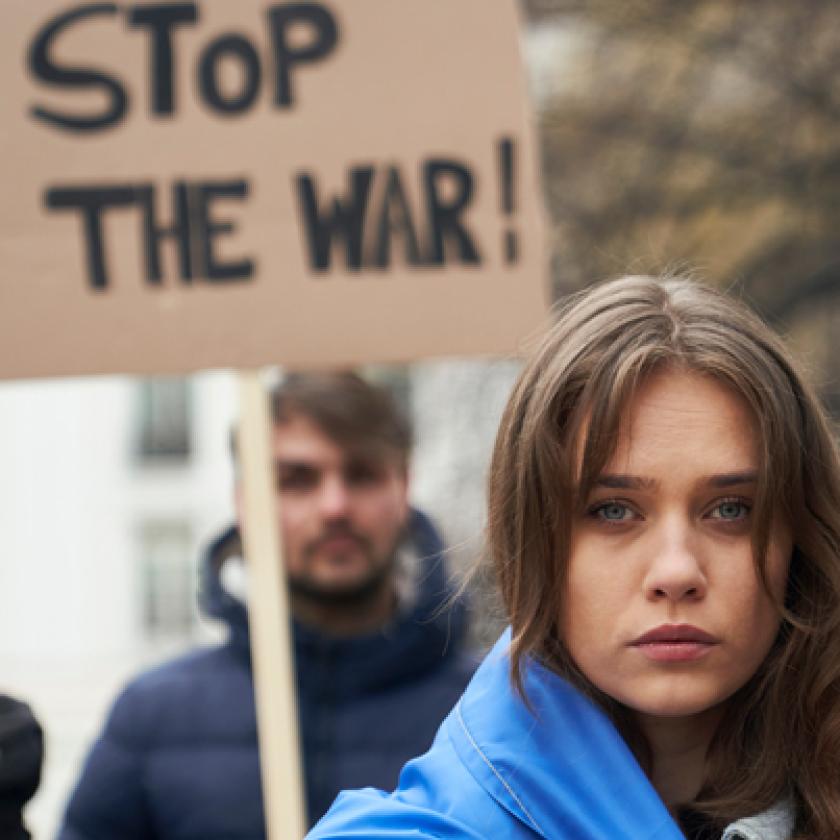 A group of people holding signs