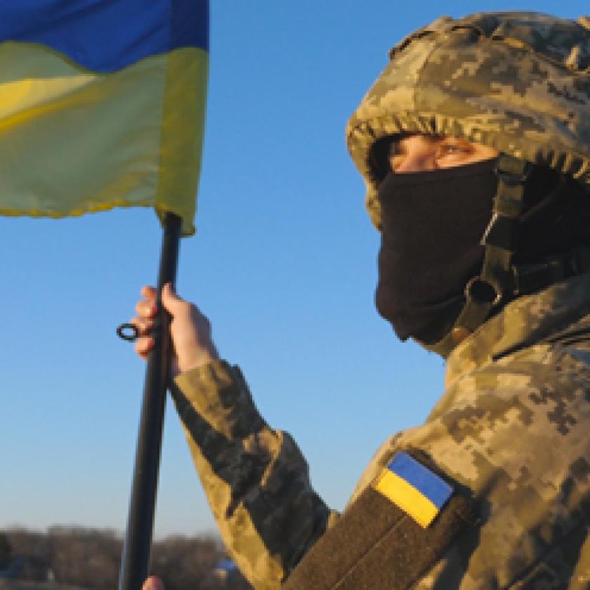 A soldier holding a flag.