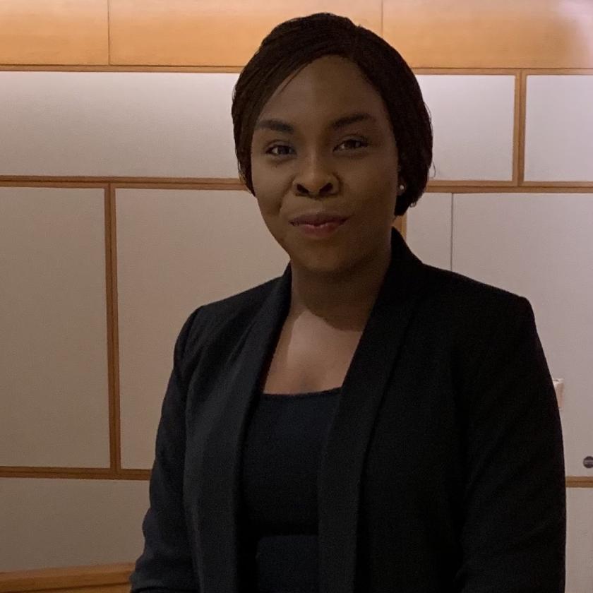 a person in a black suit.