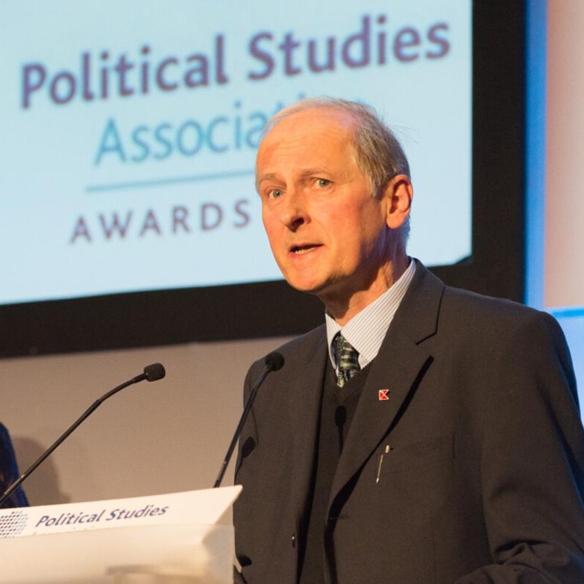 a person standing at a podium