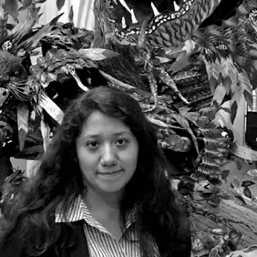 image of a woman wearing a striped shirt smiling at the camera